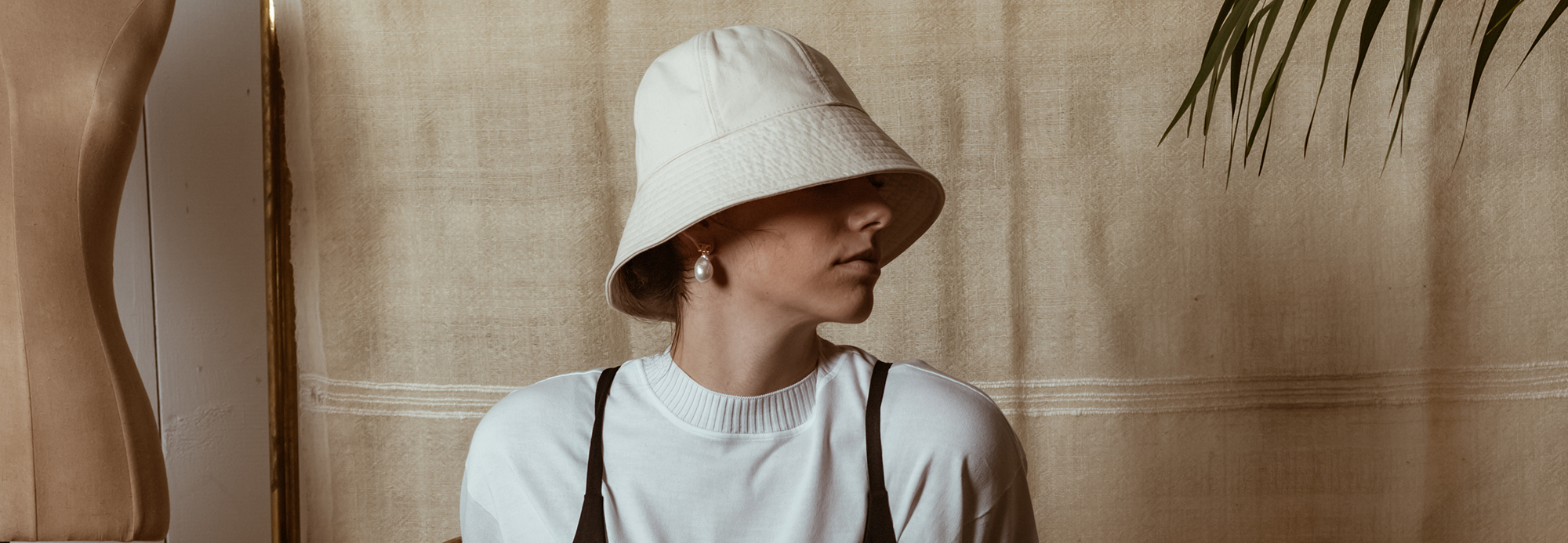 A woman wearing a bucket hat